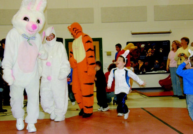 Students at Greenfield School got a chance to dance with the Easter Bunny and his friends Thursday afternoon, April 9, 2009, during the annual Dow Automotive Easter party. Greenfield Principal Rhonda Eves said the children love the event, especially the band of Dow employees who played songs for the children. "The kids see our faces all the time and we don't sing a band," Eves said. "It is great that they continue to do this for us in light of what is happening with the automotive industry." Nancy Williams, office professional for the Dow site leader, said Dow has been providing the party for Greenfield for more than 20 year. "A lot of people don't know this is funded by employee donation and the Dow Children's Fund," he said. "It's for the kids."