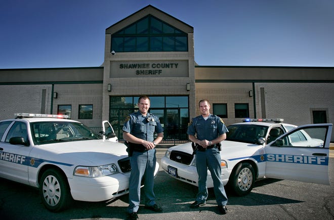 Shawnee County sheriff's deputies and identical twins Kyle, left, and Craig Cochran work the same overnight shift.