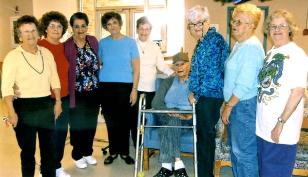 Members of the VFW Auxiliary 3693 visited Gonzales Healthcare Center Feb. 24 to host a bingo game and deliver ice cream to the residents. Shown during the event are, from left, members Norma Lukse, Lillie Frederic, Effie Ronkartz, Gertie Savoy, Lois Croom, GHC resident Louis Gautreau, Adeline Guedry, Mabel Felps and Carolyn Mire.