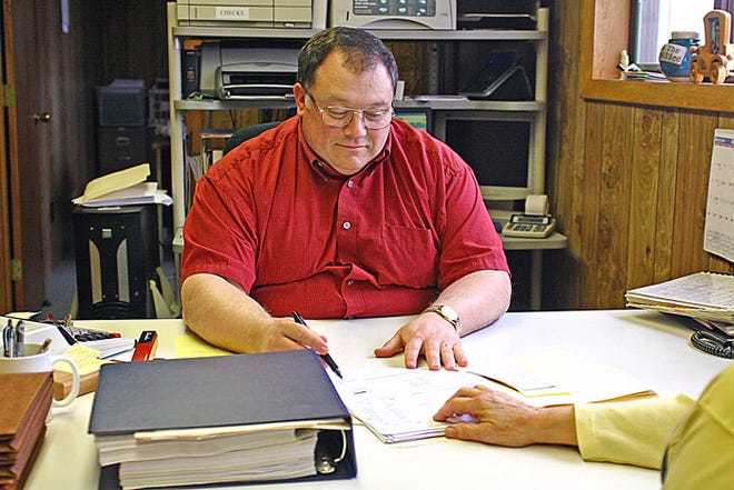Bill Ayers of the accounting firm William Ayers & Associates Inc. prepares taxes for a client ahead of Wednesday’s deadline. The Post Office used to have extended hours on April 15 to give people a little more time to complete their paperwork, but the explosion in electronic filing has seemingly eliminated the need for that service.
