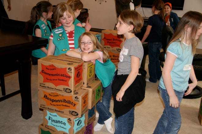 Girl Scout Troop 4190 in Morton gathered boxes of Girl Scout cookies March 27 and prepared them for shipping to soldiers in Iraq. The troop has continued to do so for the past five years. In 2007, they sent 140 boxes. This year, they sent 500 boxes of cookies.