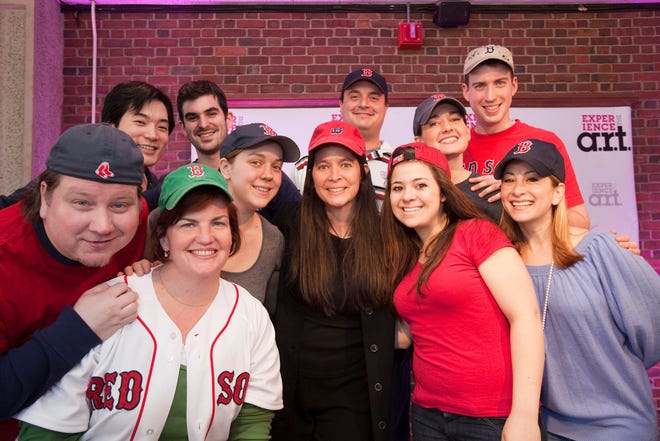Diane Paulus with members of the group that sang a song from Red Sox Nation, one of the American Repertory Theatre's productions in the 2009-2010 season at a press conference.