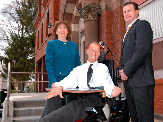 Frankie Flint of Holbrook, who had cerebral palsy, has died at age 33 after a 16-month battle with lymphoma. He is seen here in 2006 with Josephine Ruthwicz, the town’s former director of community development, and Mike Spinelli, then-senior vice president at Holbrook Cooperative Bank.