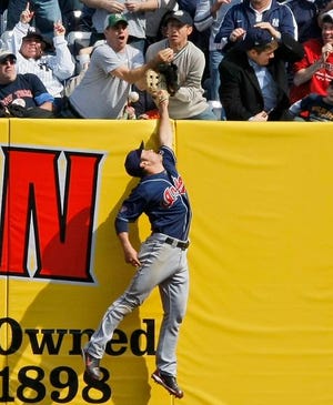 Indians right fielder can't haul in Jorge Posada's two-run homer in the seventh inning Sunday.