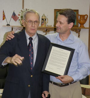 Casimer Celske accepts a Proclamation from his son Mayor Lee Celske.