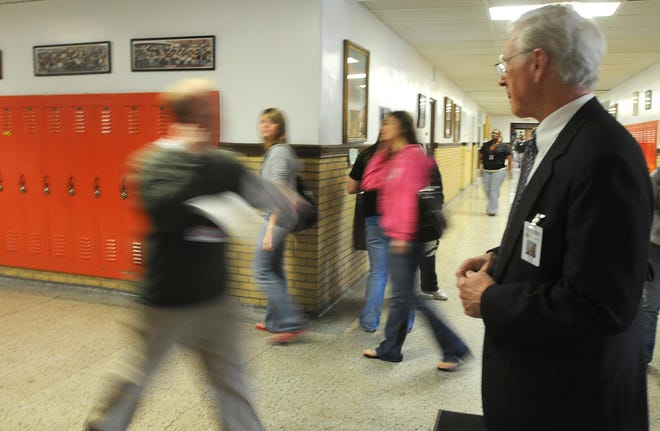 Dr. Peter Flynn, Freeport School District 145 Superintendent, stands in the hallway of Freeport High School during a passing time between classes Monday.