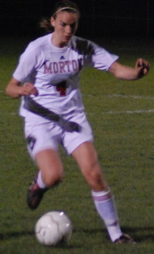 Pushing it ahead: Morton sophomore Holly Bennett looks to create an opportunity for the girls soccer team Thursday. The Potters tied Mid-Illini Conference rival Dunlap, 3-3.