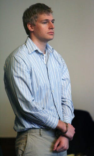 Boston University medical student Philip Markoff stands during his arraignment in Boston Municipal Court, Tuesday, April 21, 2009, in Boston. Markoff has been ordered held without bail on charges that he fatally shot a masseuse he had lured to his hotel through Craigslist.