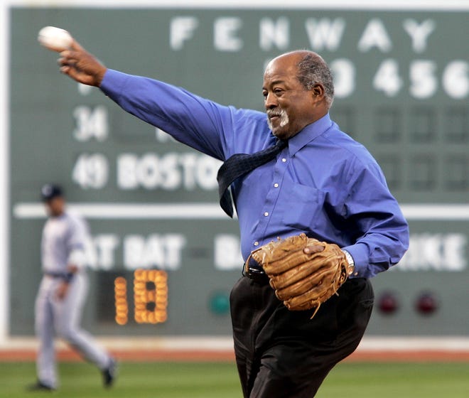 Former Boston Red Sox pitcher Luis Tiant throws the ceremonial first pitch prior to a 2006 game against the New York Yankees at Fenway Park.