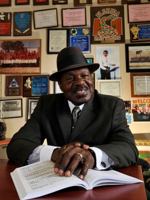JON M. FLETCHER/The Times-UnionSurrounded by mementoes from 49 years as a music teacher at multiple schools, Ribault High School choral director Eugene White is retiring this year.