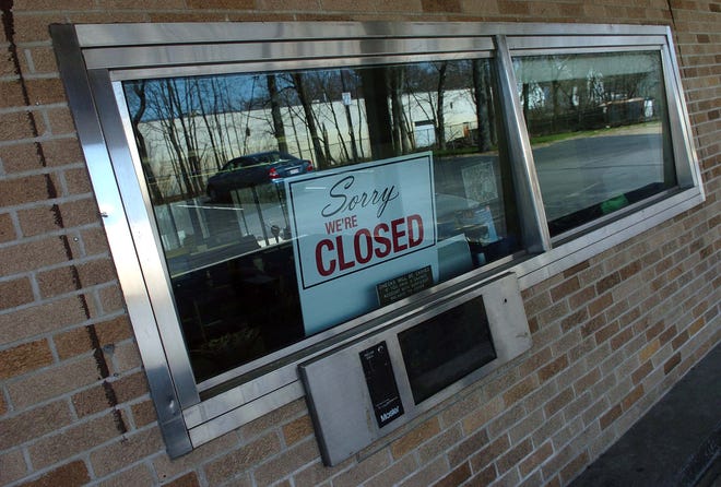 The bank at the Mutual Bank at 656 Crescent St., Brockton, is closed as indicated in the drive through window sign.