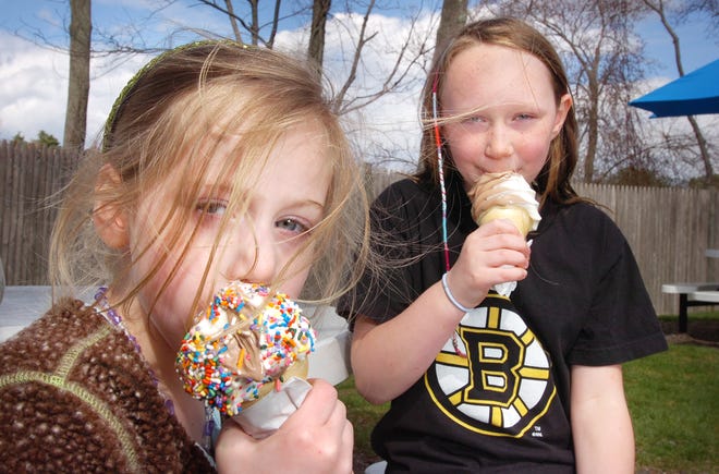 After a school vacation week sleepover, Valentine McNeilly, 5, of Scituate, left, and Stephanie Coleman, 10, of Braintree, enjoy their cones at JJ’s Dairy Hut in Cohasset on Thursday.
