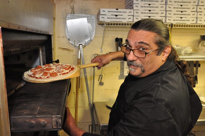 Chef Frank Ruffino puts a freshly made pizza in the oven at his Blue Highway Pizza in Micanopy on Feb. 28.
Chef Frank Ruffino puts a freshly made pizza in the oven at his Blue Highway Pizza in Micanopy on Feb. 28.