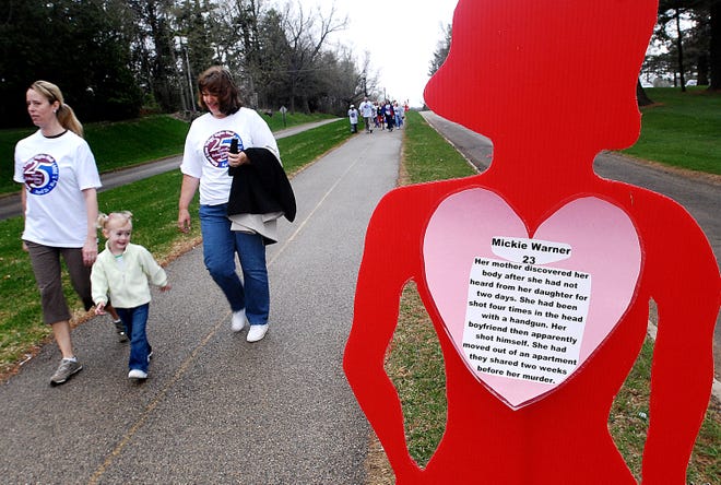 (L-R) Kelley Munda and her daughter Delaney Munda, 2, of Baileyville and Laurie Ruthe of Freeport "walk a mile in my shoes" for crime victim awareness at Krape Park Saturday, April 25, 2009. April 26 through May 2 has been named National Crime Victims' Rights Week.
