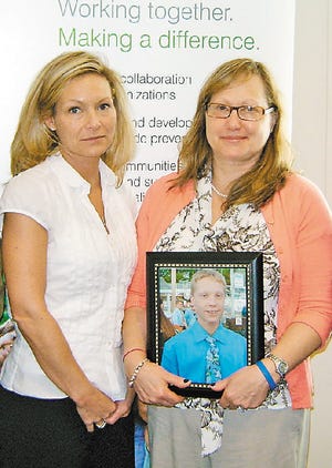 Emily Bachand, left, and Joan Owens, aunt and mother, respectively, of Samuel Montana D’Olimpio, say the Barnstable teen felt pressured to achieve in sports before his suicide in 2005.