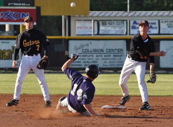 St. Amant’s Caleb Templet turns a double play as Dutchtown’s Jesse Buratt slides into second base during the Griffins’ 14-0 District 6-5A victory Thursday afternoon.
