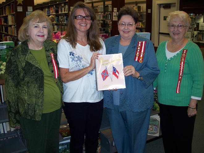 Maryanne Whatley, library assistant Brenda Hakanson, Alecia Evans and Faye Morgan.