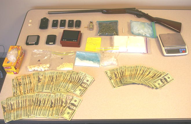 More than 2 pounds of cocaine, thousands of dollars in cash, a shotgun and drug paraphernalia were seized in an early-morning bust at three Plymouth homes, leading to the arrest of five people.