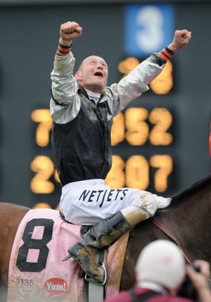 Calvin Borel reacts after riding Mine That Bird to a victory in the 135th Kentucky Derby horse race at Churchill Downs Saturday, May 2, 2009, in Louisville, Ky.