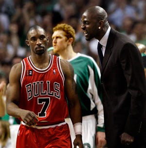 Boston Celtics' Kevin Garnett, right, has words for Chicago Bulls' Ben Gordon during a timeout in a first-round NBA basketball playoff game in Boston Tuesday, April 28, 2009. The Celtics won 106-104 in overtime, and leads the series 3-2. (AP Photo/Elise Amendola)