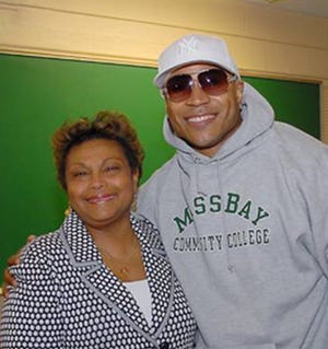 Rapper LL Cool J meets with MassBay Community College President Carole Berotte Joseph when he came to the school to talk to students about making smart decisions.