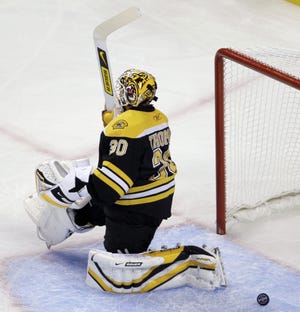 Bruins goalie Tim Thomas reacts after giving up a goal during Boston's 3-0 loss to the Hurricanes.