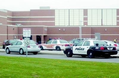 Canandaigua Academy has been surrounded by sheriff's and city police patrol cars. Officers brought bomb and drug-sniffing canines to search the building.