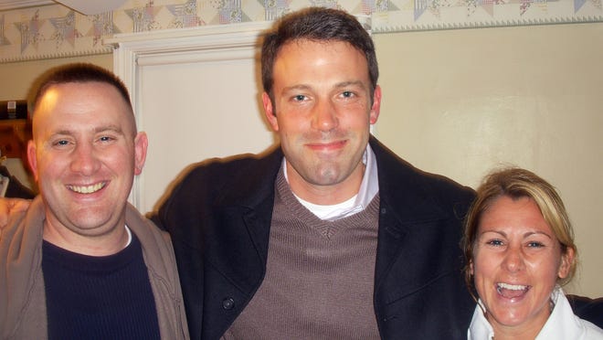 Ben Affleck smiles for a photo during filming at 18 Watson Road, Quincy Point, for “The Company Men.”