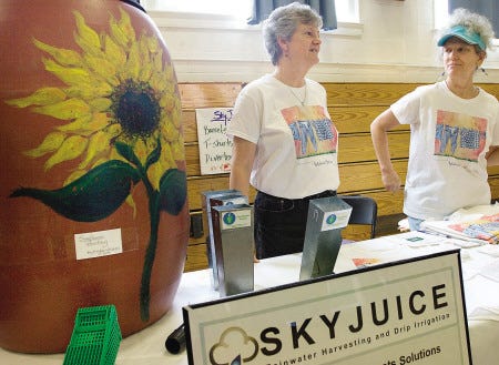 Janet Thompson and Kay Cichon, with Sky Juice New England, answer questions about their products during the York Energy and Climate Fair held Saturday at York Middle School.
