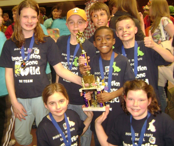 Students at Horace Mann Lab School are raising money so their team can attend the Destination ImagiNation Global finals in Tennessee. The team members are pictured at the regionals. From left are Madison Roccio, Guthrie Scrimgeour, Mike Mitchell, Cameron Fraser, Grace Harrison, Maddie Borden. and Jaden Oliver (holding trophy).