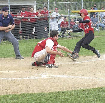 Colon catcher Curtis Hiler blocks the plate of a Litchfield runner Friday, tagging him out.