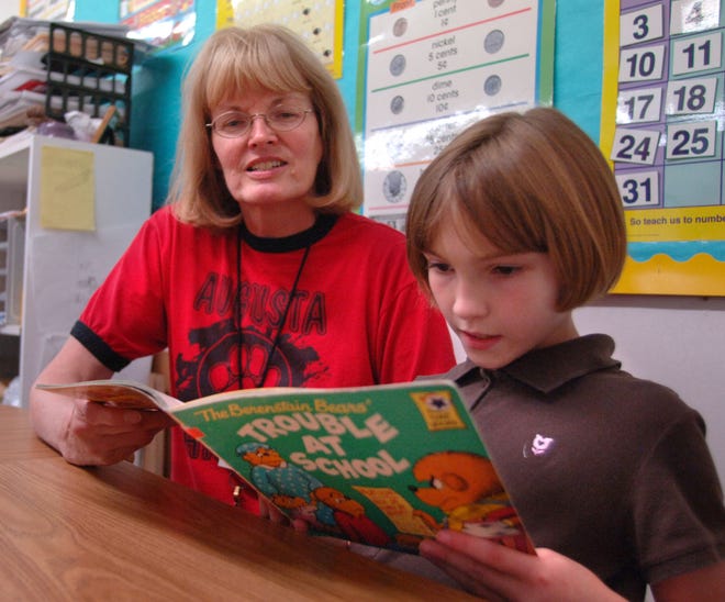 JIM BLAYLOCK/Morris News ServiceAugusta Christian Schools third-grader Shay Koger, 10, reads for her teacher, Judy Henning, in the school's Talent Development Program for pupils with reading disabilities.