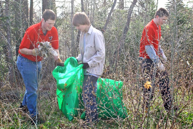 The City-Wide Clean-Up brought more than 100 members of the community together to do a little spring cleaning in Sault Ste. Marie. This particular group of volunteers — representing the Soo Robotics Team and consisting of mentor Dereck Wonnacott and 14-year-old students, Dan LaFord and Matthew Johnson — concentrated their efforts in a wooded area near Cascade Crossings. While the forecast had been calling for chilly temperatures and maybe even some showers, the volunteers were greeted with a beautiful spring day for their event.