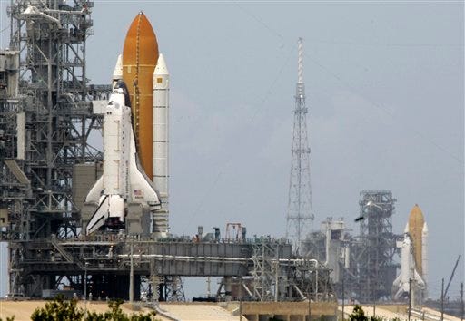 Space shuttle's Atlantis, left, and Endeavour are shown on their launch pads at Kennedy Space Center in Cape Canaveral, Fla., Friday, April 17, 2009. Endeavour will stand by at pad B in the unlikely event that a rescue mission is necessary during space shuttle Atlantis' upcoming mission to upgrade NASA's Hubble Space Telescope.
