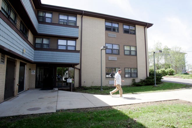 Rockford Housing Authority foreman Bob Lowe walks out of Summit Green Apartments on Thursday, May 7, 2009, at 1514 E. State St. in Rockford.
