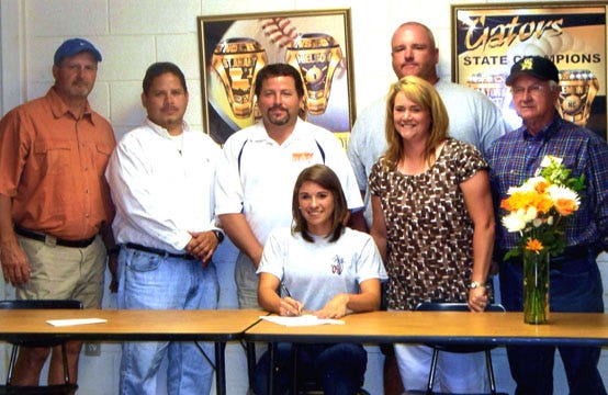 St. Amant’s Amanda Martin signed a softball scholarship to Louisiana College in Pineville May 5. Martin, a pitcher and outfielder, made All-District this past season compiling an 8-0 record with a .28 ERA?and 50 strikeouts in 49 innings. Martin also batted .364 with 20 runs, 15 RBIs and 10 stolen bases. She is pictured with batting coach Steve Eubanks, St. Amant assistant and AYSA coach Tommy Jara, Louisiana Heat coach Brian Addington, pitching coach Claudia Gremillion, St. Amant head coach?Scott Nielson and pitching coach Ronnie Gaudin.
