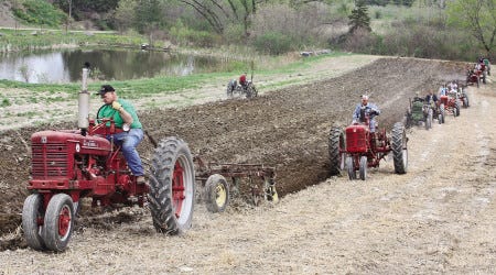 Antique tractors strut their stuff plowing a field at Applecrest Farm in Hampton Falls on Sunday, May 3.