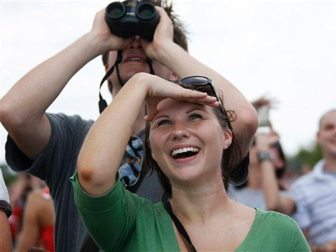 Sophie Taylor, on holiday from London in Florida, came to watch the space shuttle launch, near Veterans Park in Titusville, Fla. Monday, May 11, 2009, on a mission to repair the Hubble telescope.