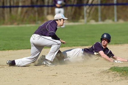 Traip baserunner Nate Hippern slides into second base, where he is tagged out by York’s Tanner Chase during a Western Maine baseball game in York, Maine, Monday.
Deb Cram photo
