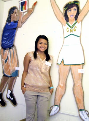 Christie Pono, an seventh student at Gonzales Middle, stands next to her “Pop Self Portrait” she created.