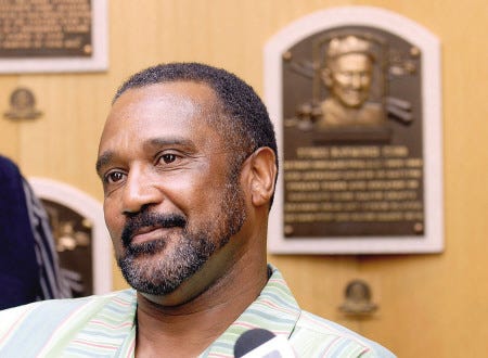 Baseball Hall of Fame 2009 inductee Jim Rice speaks with reporters on a tour of the National Baseball Hall of Fame and Museum in Cooperstown, N.Y., on Friday. In the background is Ty Cobb’s Hall of Fame plaque.