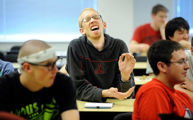 Neumont University student Logan Neufeld laughs during a class in South Jordan, Utah. Instead of Mardi Gras, Neumont students hold Nerdi Gras, a video game party.LOS ANGELES TIMES / WALLY SKALIJ
