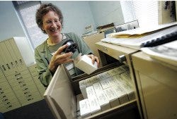 Photo by Amy Paterson/New Jersey Herald
 Reference librarian Susan McCabe talks about the microfilm archives kept at the main branch of the Sussex County Library in Frankford. McCabe helps patrons access the information they need whether its on microfilm, in a book or online.