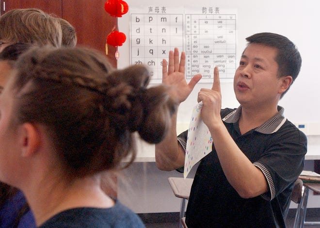 Yonghui Ren instructs Jackson students in the Chinese language. Seven Jackson students will travel to China this summer.