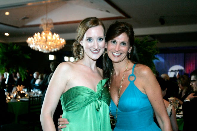 Ellissa Schwartz (left) and Andrea Bear, both of Rockford, stand during Rockford Health Gala Xcitement!, an evening to benefit the Rockford Memorial Development Foundation, on Saturday, May 16, 2009, at Cliffbreakers in Rockford.