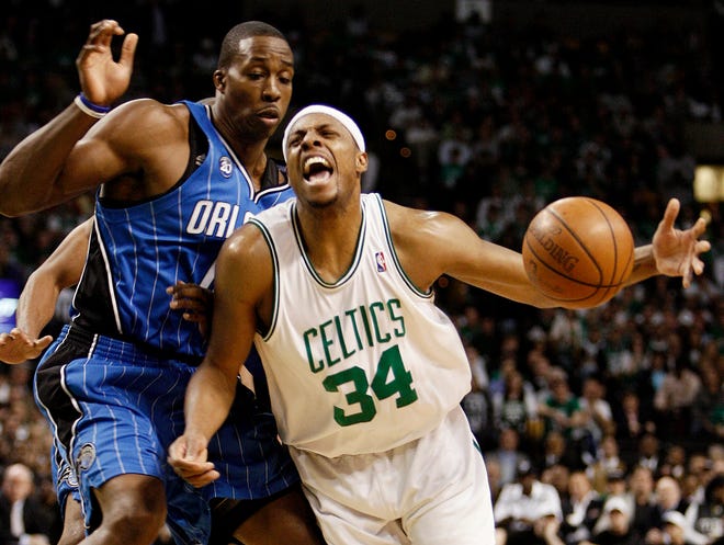 Paul Pierce loses the ball while driving on the Magic's Dwight Howard during the first half of the Celtics' 101-82 loss on Sunday night in Game 7 of their second-round playoff series.