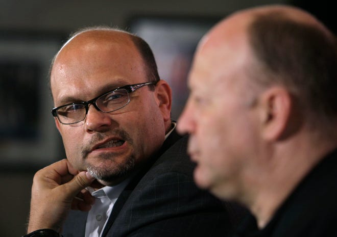 Boston Bruins general manager Peter Chiarelli looks over towards head coach Claude Julien during a news conference Monday, May 18, 2009, in Boston. The Bruins were eliminated in overtime of Game 7 by the Carolina Hurricanes in the NHL hockey Eastern Conference semifinals. (AP Photo/Charles Krupa)