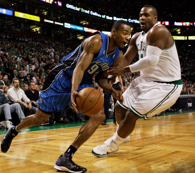 Orlando Magic forward Rashard Lewis (9) drives on Boston Celtics' Glen Davis, right, in the first quarter of Game 7 of the NBA basketball Eastern Conference semifinal playoff series in Boston on Sunday, May 17, 2009. (AP Photo/Elise Amendola)