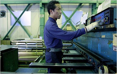 Hiroyuki Taruki, executive director of High Metal in Osaka, worked with a shearing machine at the factory.