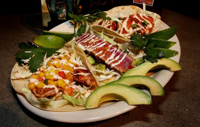 KELLY JORDAN The Times-UnionA variety of specialty tacos are available at TacoLu Baja Mexicana at Jacksonville Beach, including, Mahi Tacos with mango salsa (from left), Taco Rosa and Bangin' Shrimp Tacos.